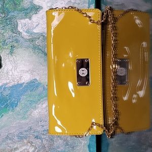 New without tags. Antonio Melani banana yellow clutch with gold chain.